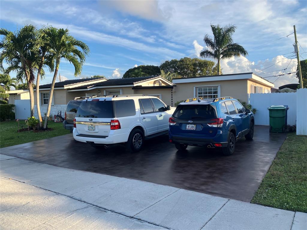 7960 Northwest 174th Street Hialeah, FL 33015 - Photo 2 of 20 a car parked in front of a house
