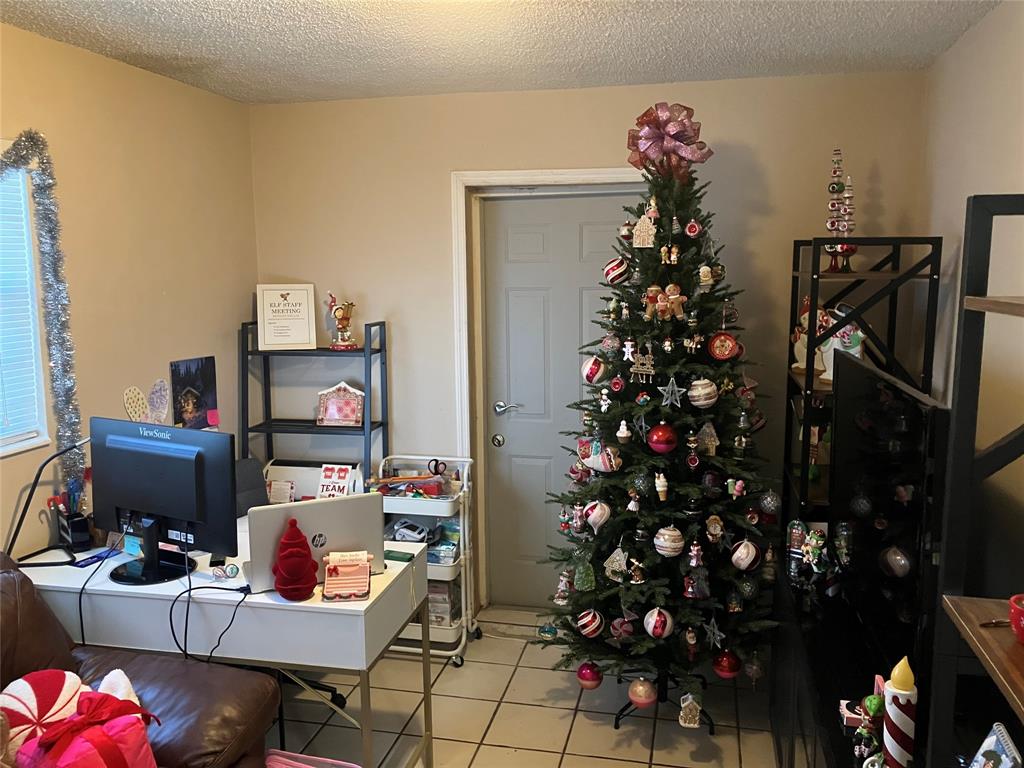 7960 Northwest 174th Street Hialeah, FL 33015 - Photo 5 of 20 a living room with furniture a flowers and a fireplace