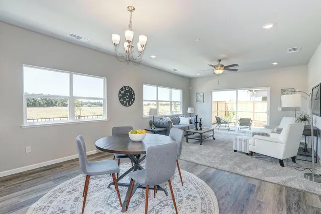 a view of a dining room with furniture window and outside view
