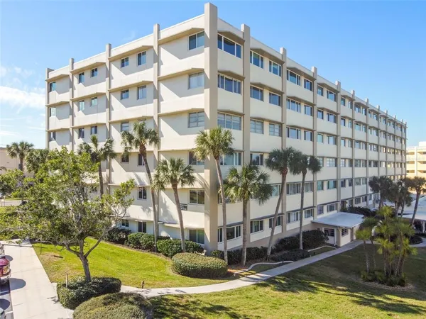 a view of a swimming pool and a yard
