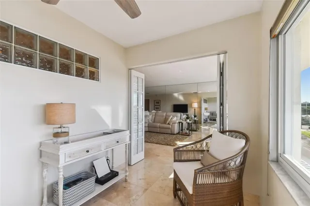 a living room with furniture and flowers