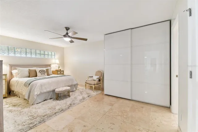 a bedroom with bed and a window