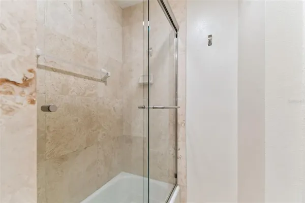 an aerial view of a swimming pool with outdoor seating