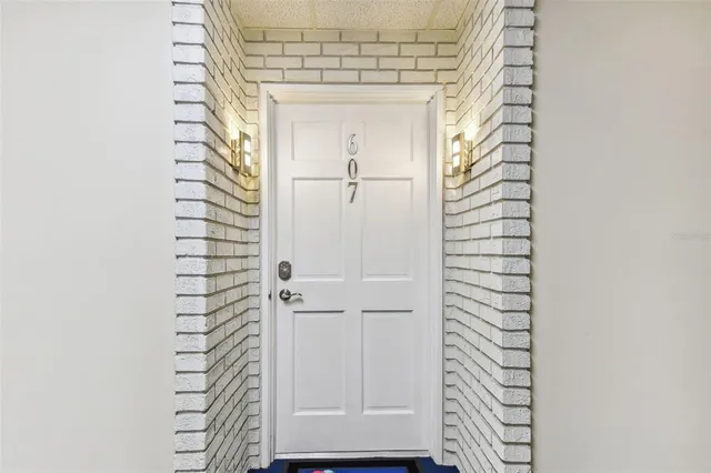 a kitchen with a refrigerator and a sink