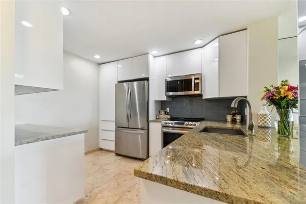 a kitchen with a stove and a microwave