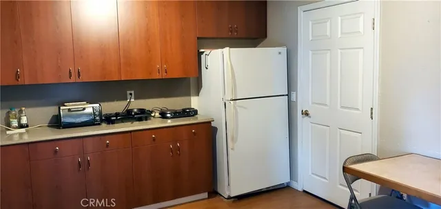 a white refrigerator freezer sitting in a kitchen