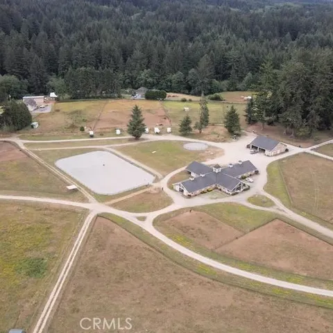a view of a swimming pool with a yard