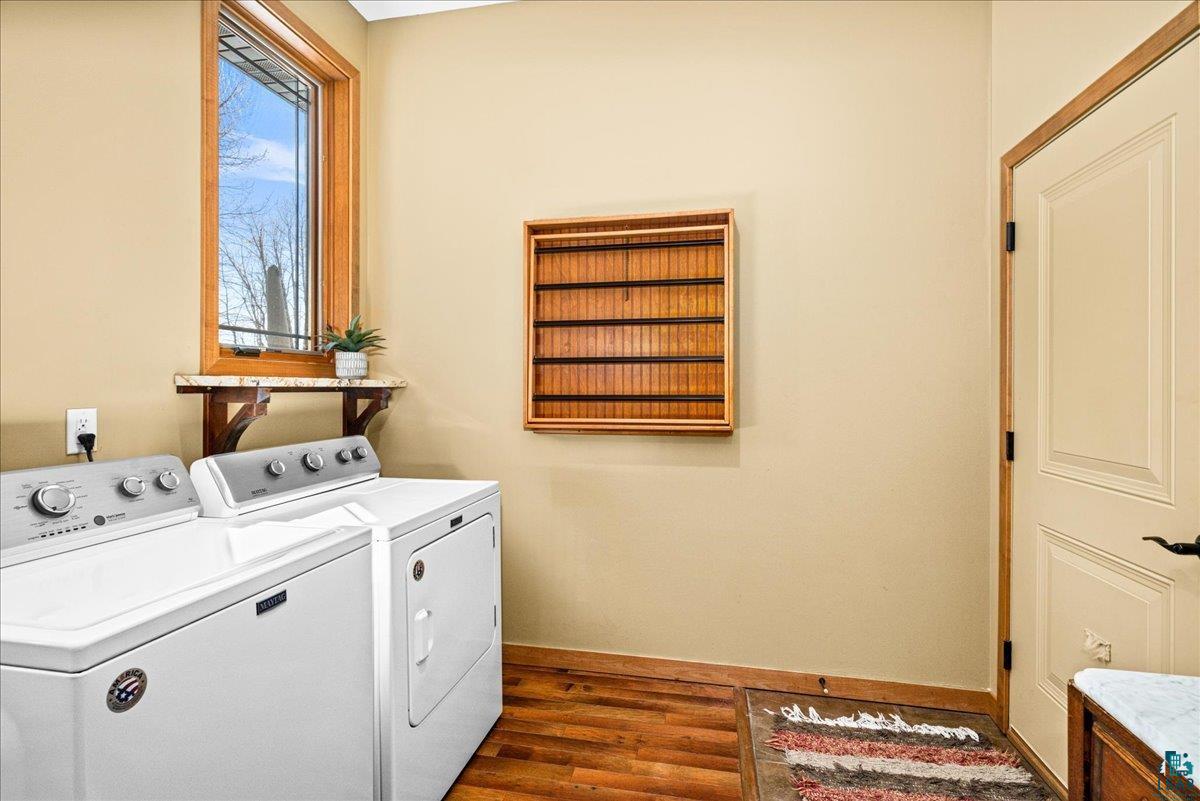 92598 Spells Road Sturgeon Lake, MN 55783 - Photo 11 of 60 Laundry room featuring independent washer and dryer and dark wood-style floors
