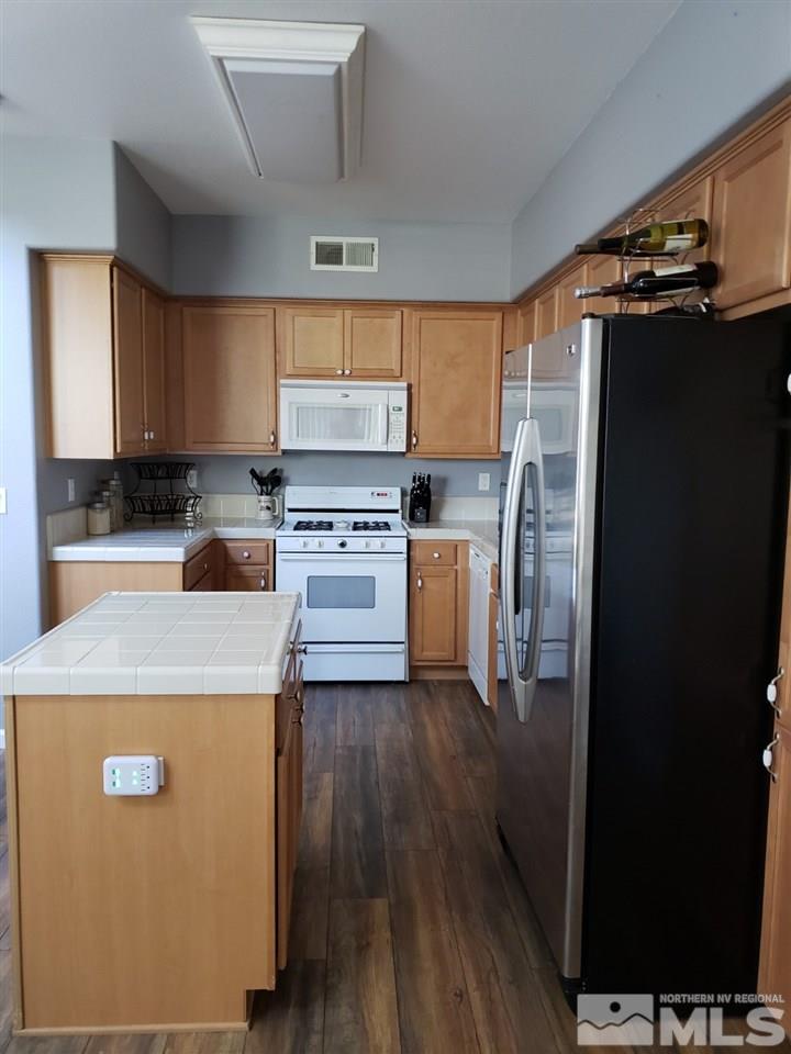 2198 Stanton Lane Reno, NV 89502 - Photo 8 of 9 a kitchen with a refrigerator sink and stove