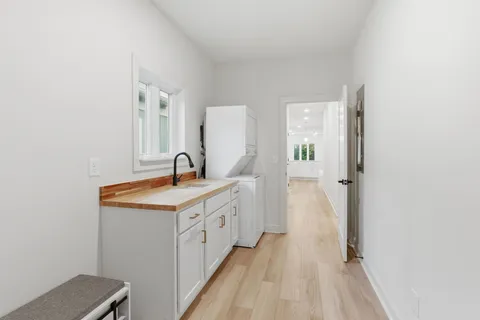 a spacious bathroom with a sink and a mirror