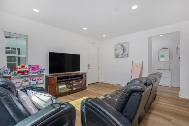 a kitchen with kitchen island a sink stainless steel appliances and cabinets