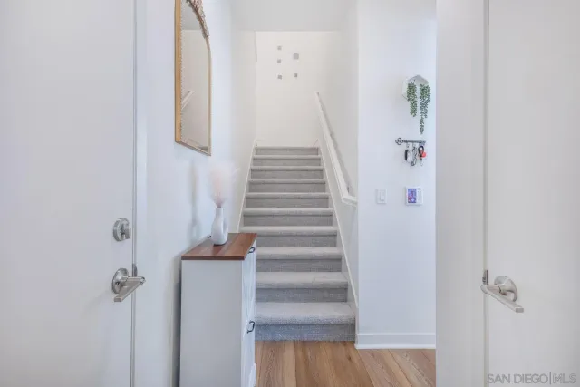 a bathroom with a sink mirror and toilet