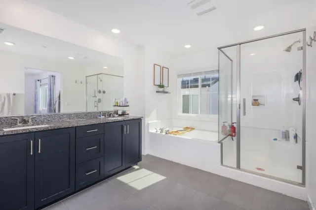 a backyard of a house with a small garden and plants