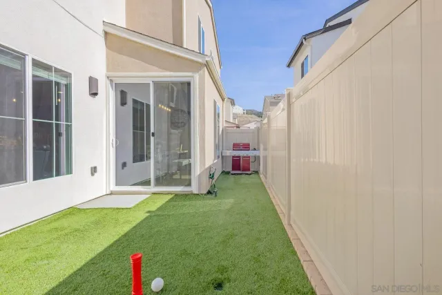 an aerial view of a house with outdoor space swimming pool