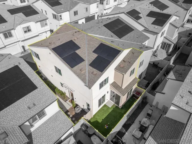 an aerial view of multi story residential apartment building with entryway