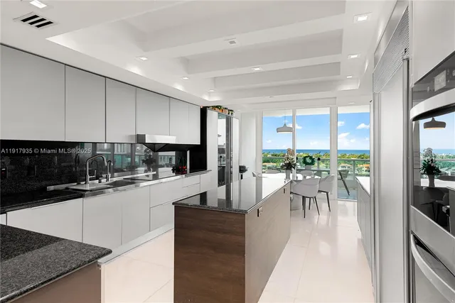 a kitchen with a sink and a large window