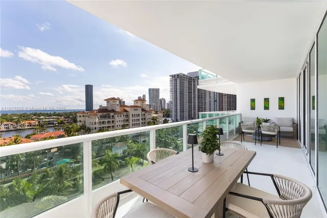 a view of a balcony with chair and wooden floor