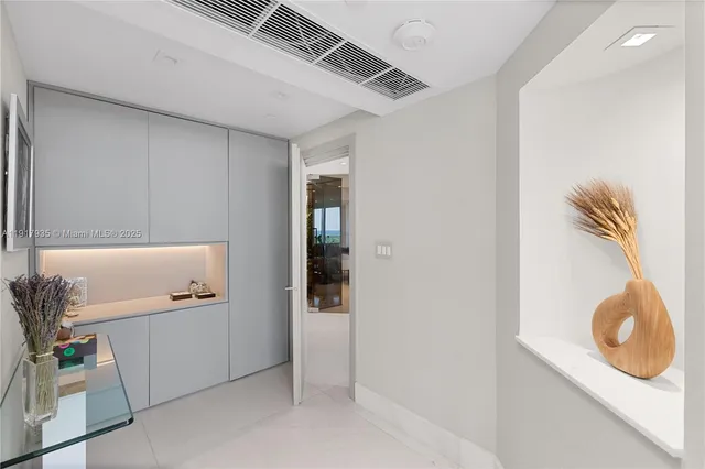 a bathroom with a sink a mirror and vanity