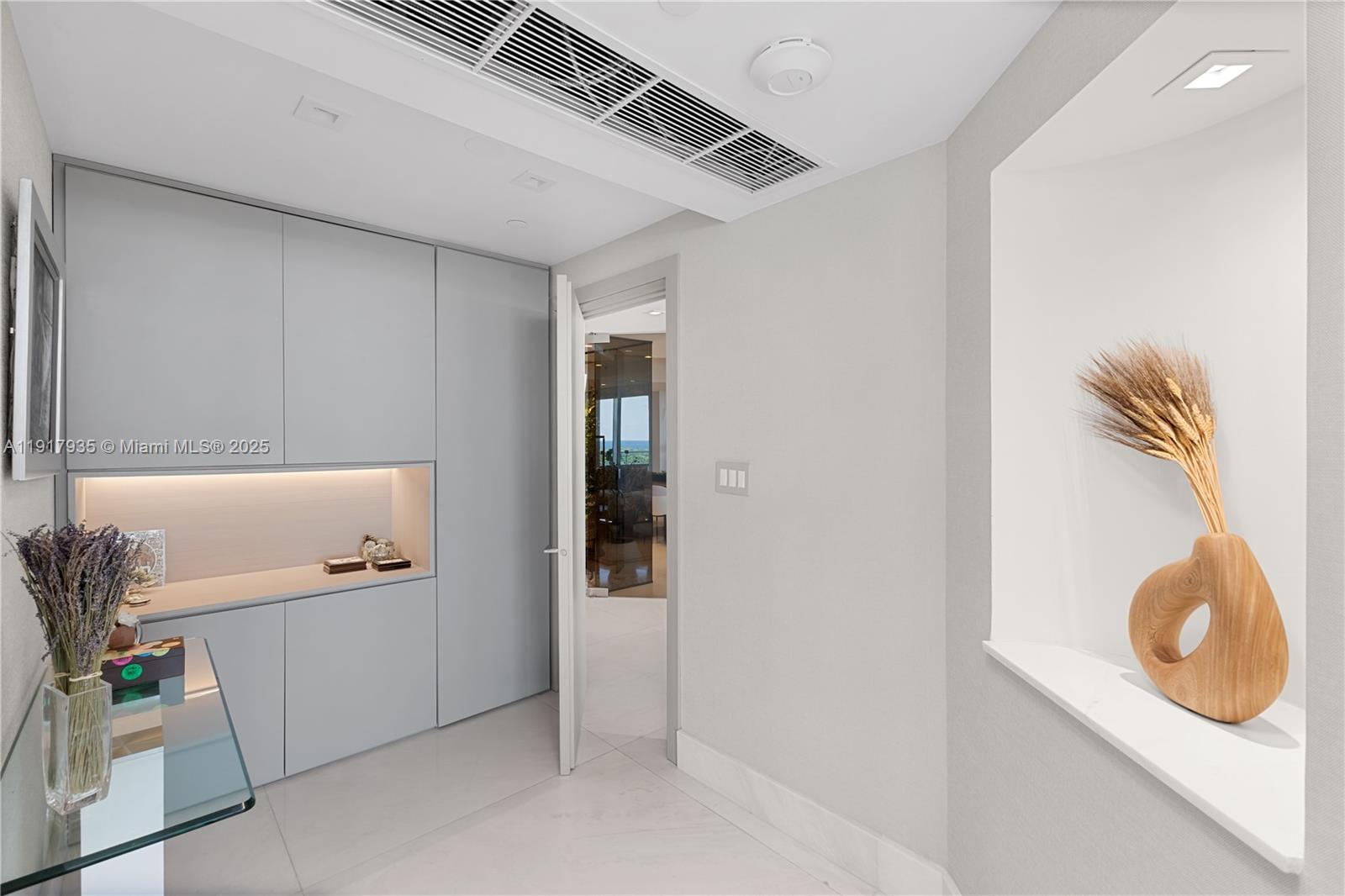 19955 Northeast 38th Court, Unit 1103 Aventura, FL 33180 - Photo 17 of 43 a bathroom with a sink a mirror and vanity