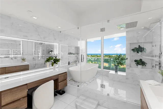 a living room with furniture and potted plants