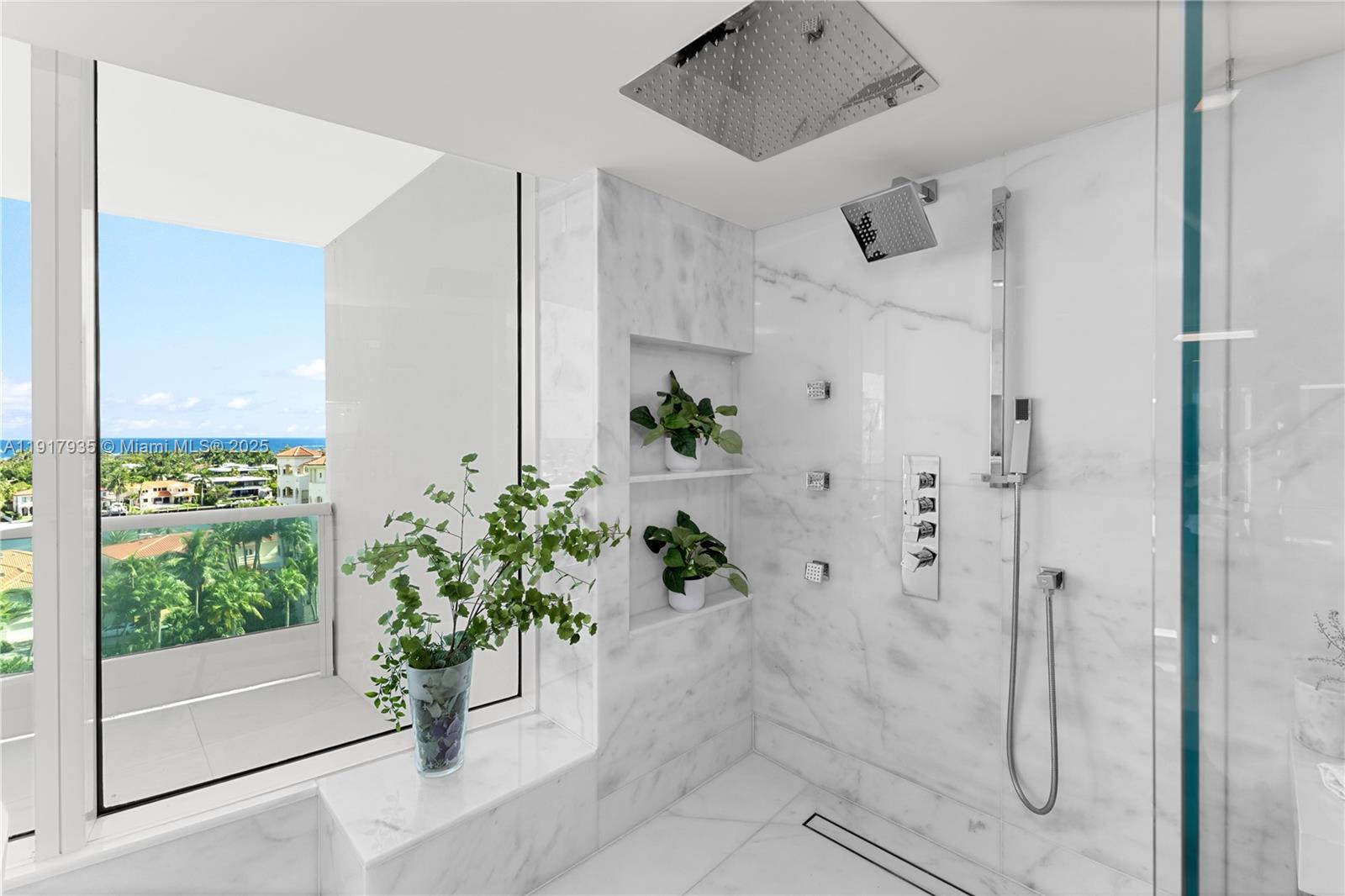 19955 Northeast 38th Court, Unit 1103 Aventura, FL 33180 - Photo 22 of 43 a view of a glass door shower