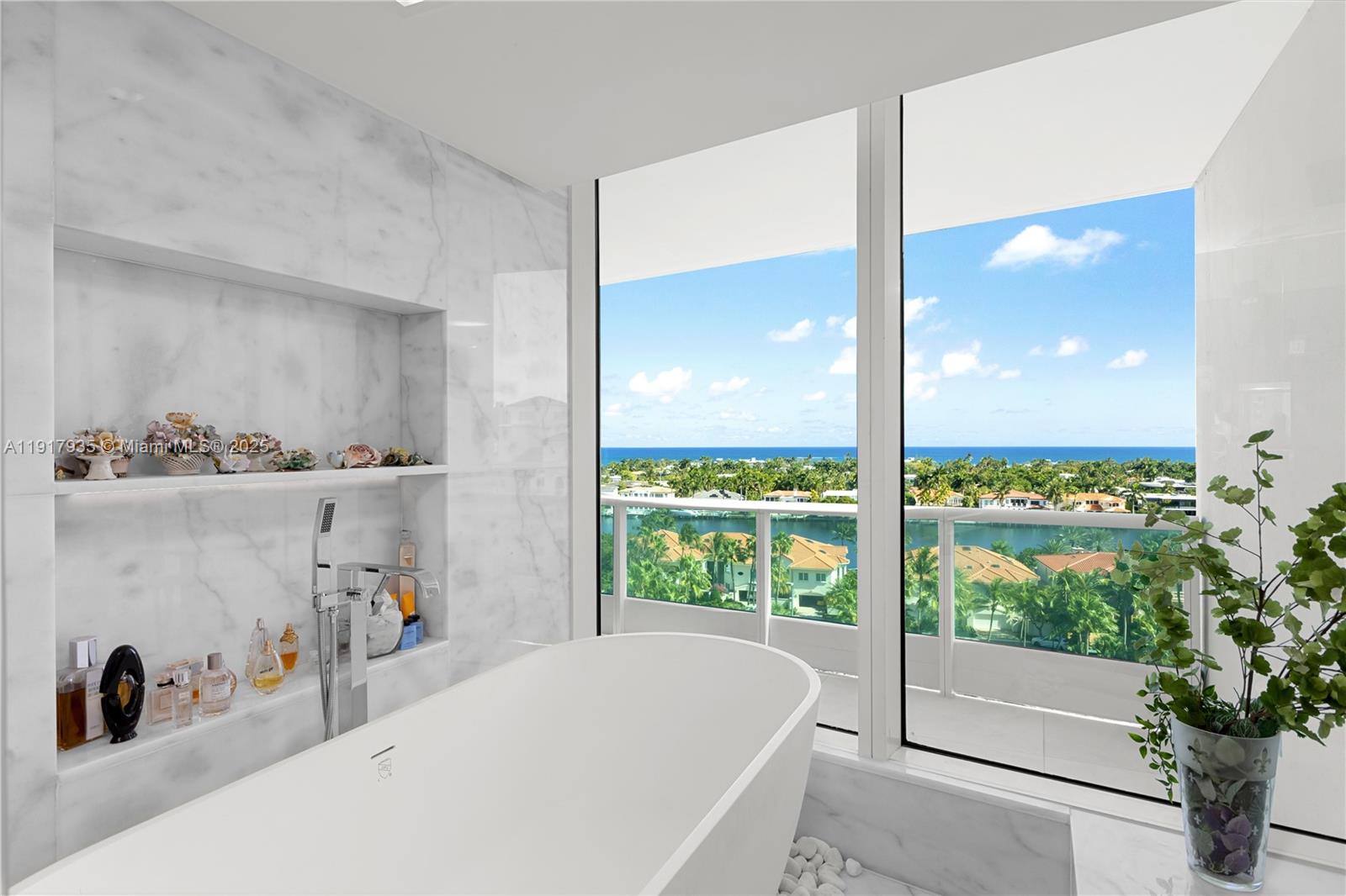 19955 Northeast 38th Court, Unit 1103 Aventura, FL 33180 - Photo 23 of 43 a bathroom with a tub and sink