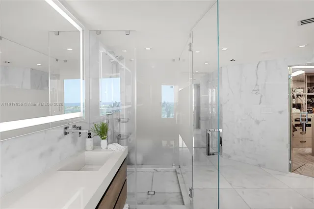 a bathroom with a bathtub and a shower