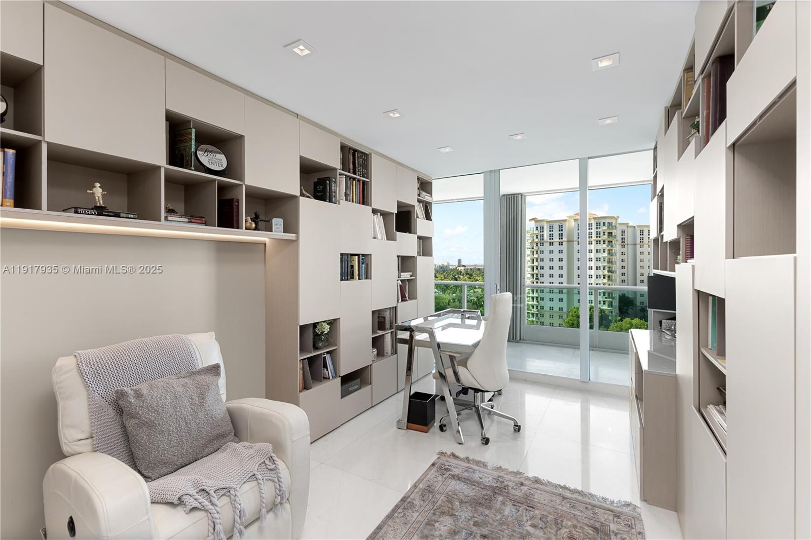 19955 Northeast 38th Court, Unit 1103 Aventura, FL 33180 - Photo 29 of 43 a living room with furniture a rug and a large window