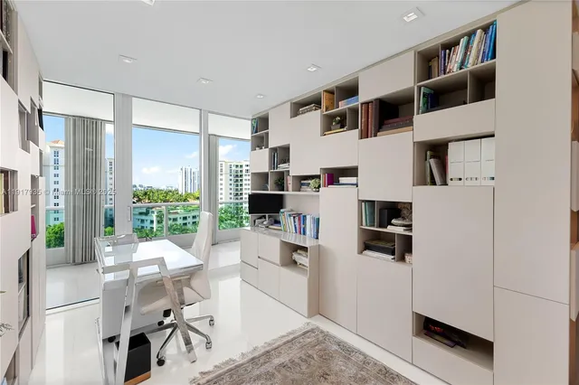 a kitchen with stainless steel appliances kitchen island granite countertop a refrigerator and a stove top oven