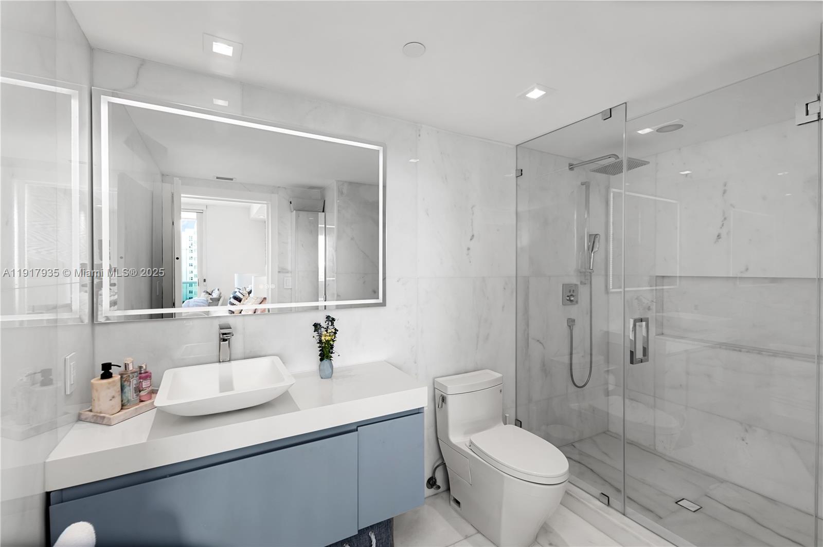 19955 Northeast 38th Court, Unit 1103 Aventura, FL 33180 - Photo 33 of 43 a bathroom with a sink toilet and shower