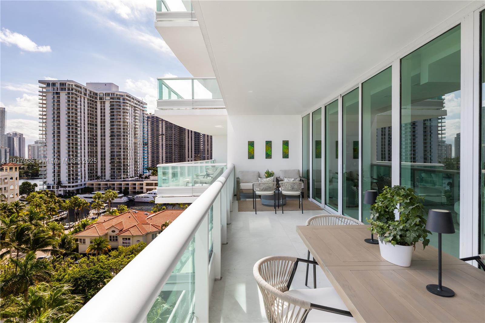 19955 Northeast 38th Court, Unit 1103 Aventura, FL 33180 - Photo 35 of 43 a outdoor space with furniture