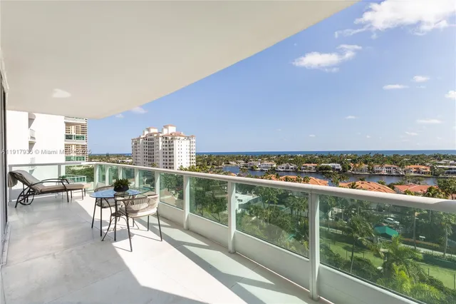 a view of a balcony with an outdoor seating