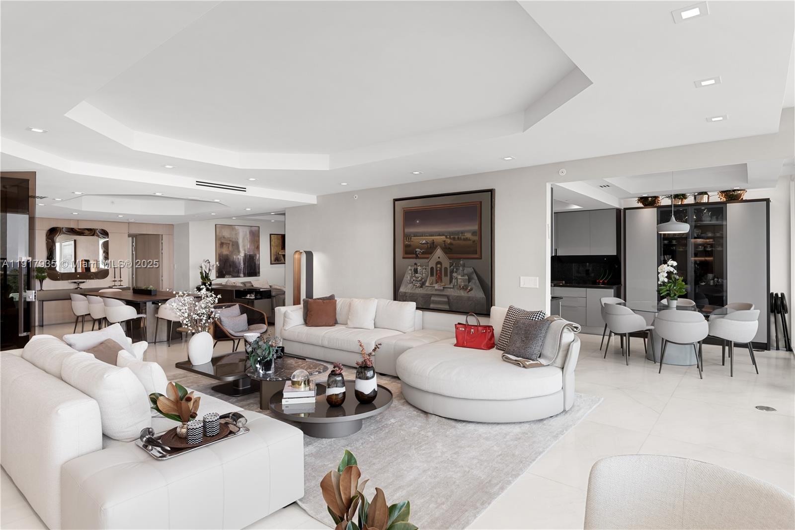 19955 Northeast 38th Court, Unit 1103 Aventura, FL 33180 - Photo 8 of 43 a living room with furniture and a fireplace