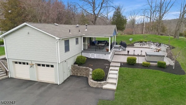 a view of a backyard with sitting area