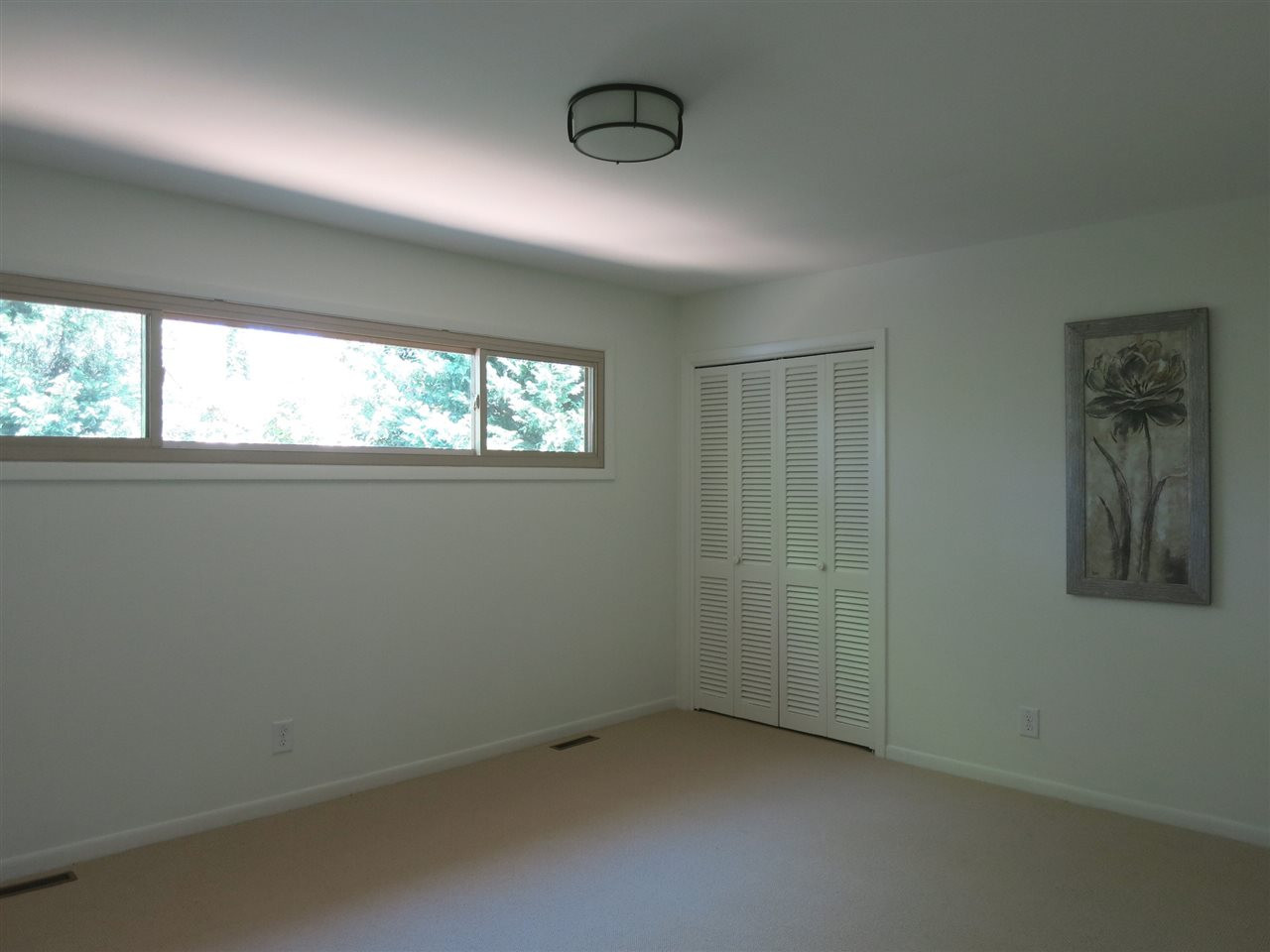 600 Davidson Street Raleigh, NC 27609 - Photo 15 of 25 There are 2 add’l spacious main level Bedrooms w/neutral carpet & lg closets. This is Bedroom 2 which has 2 closets (1 WIC). Bedroom