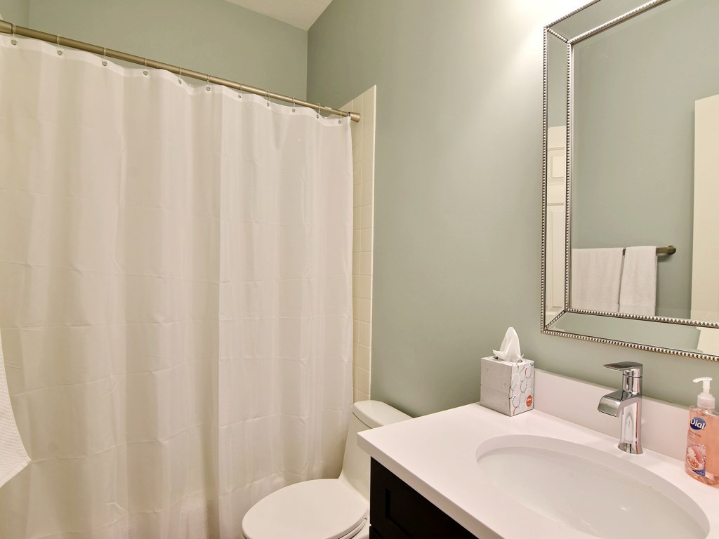 8785 Lakeside Boulevard Vero Beach, FL 32963 - Photo 19 of 36 a bathroom with a sink and a mirror