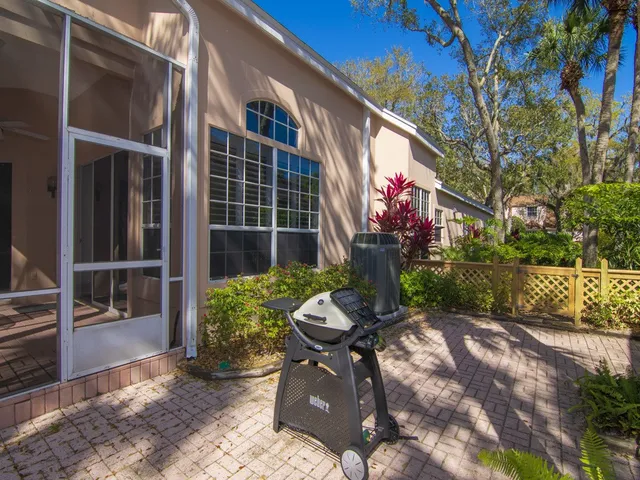 a backyard of a house with outdoor seating