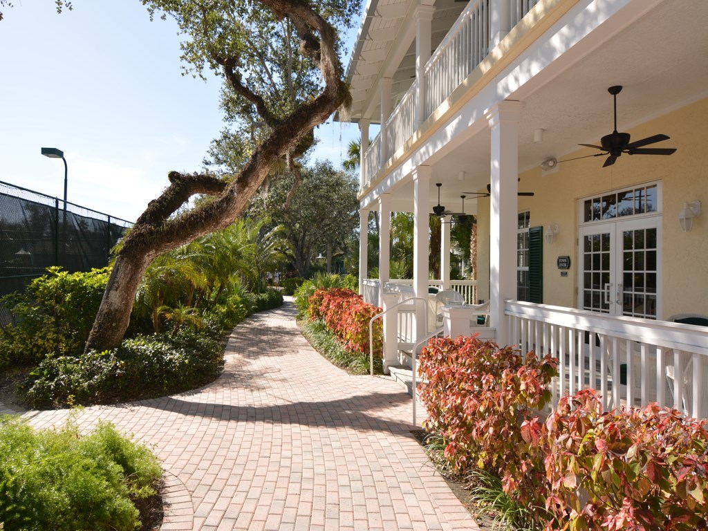 8785 Lakeside Boulevard Vero Beach, FL 32963 - Photo 33 of 36 a view of a house with a flower garden