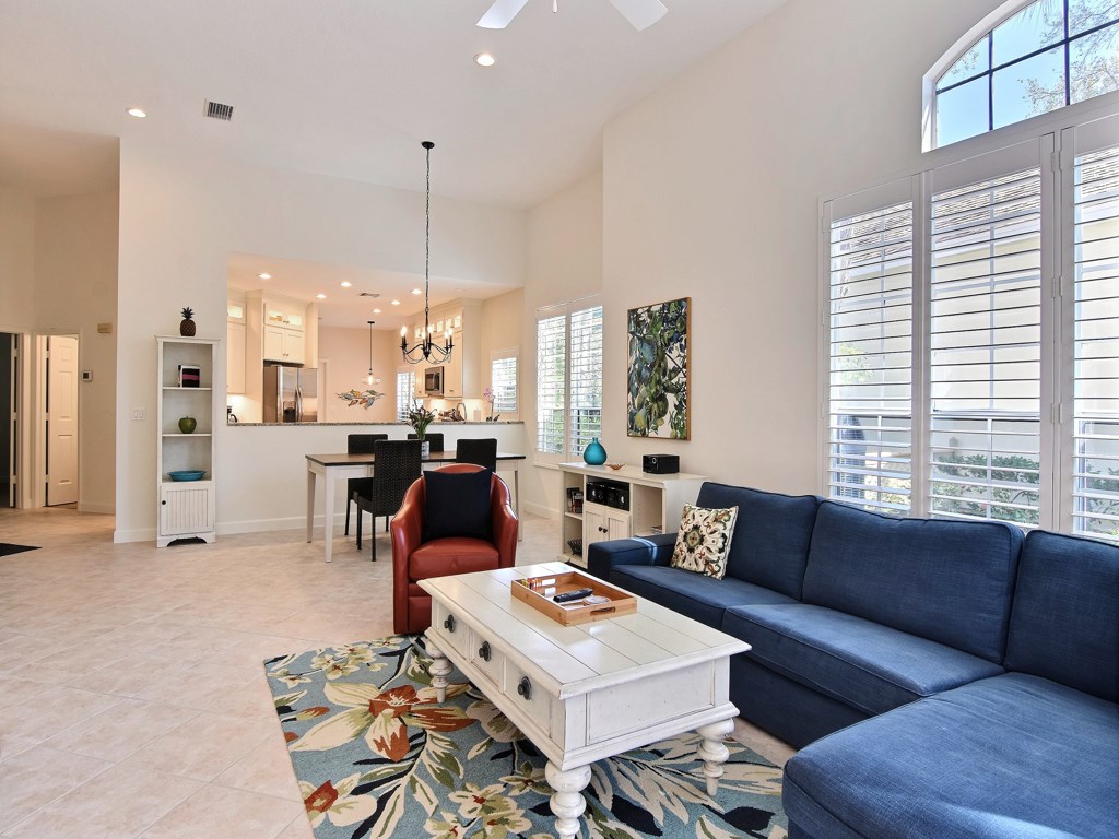 8785 Lakeside Boulevard Vero Beach, FL 32963 - Photo 6 of 36 a living room with furniture and a large window