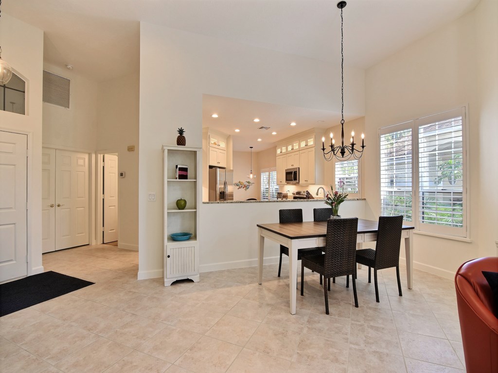 8785 Lakeside Boulevard Vero Beach, FL 32963 - Photo 8 of 36 a dining room with furniture and window