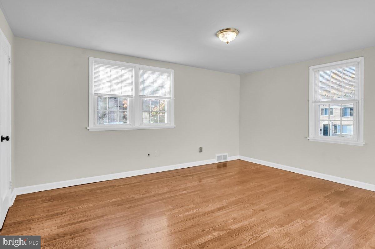250 Potomac Road Wilmington, DE 19803 - Photo 18 of 26 a view of an empty room with wooden floor and a window