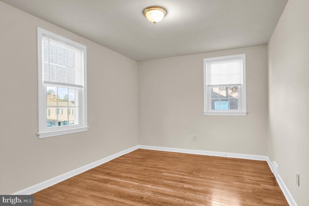 250 Potomac Road Wilmington, DE 19803 - Photo 20 of 26 a view of an empty room with wooden floor and a window
