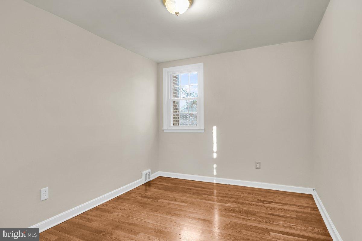 250 Potomac Road Wilmington, DE 19803 - Photo 21 of 26 a view of an empty room with wooden floor and a window