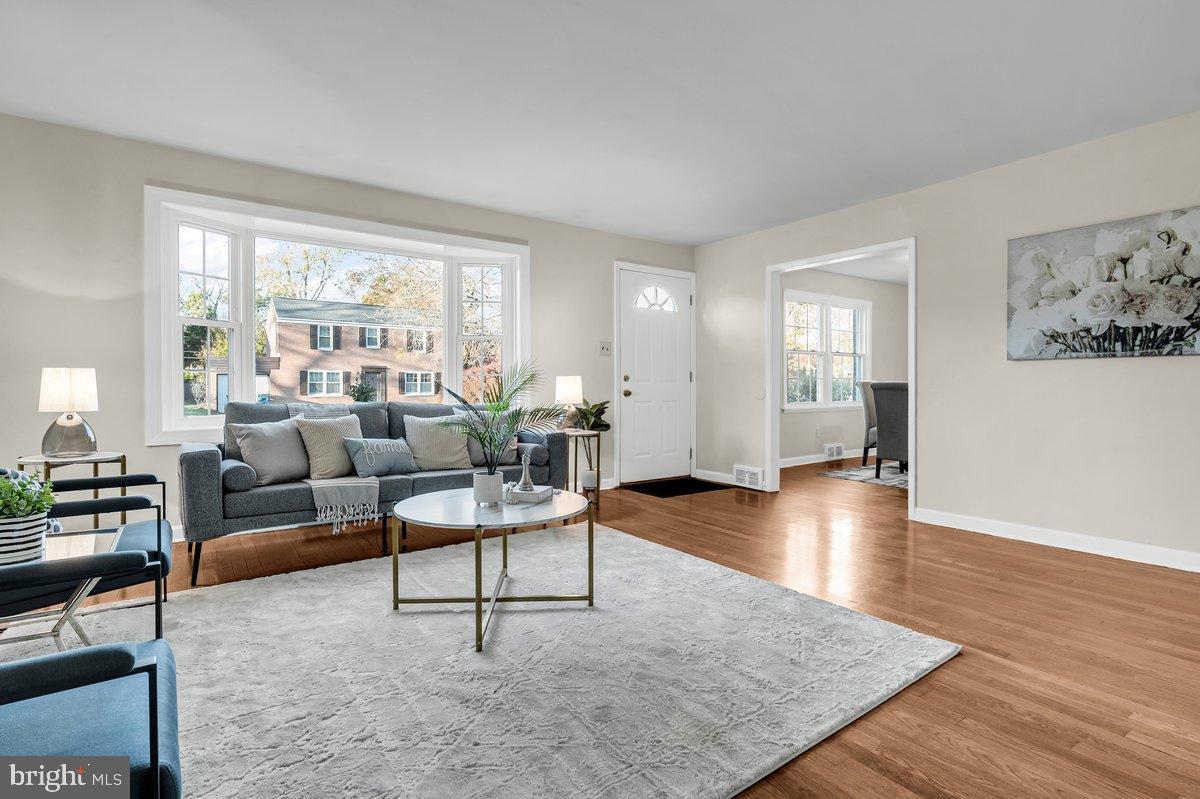 250 Potomac Road Wilmington, DE 19803 - Photo 8 of 26 a living room with furniture and a large window or wooden floor