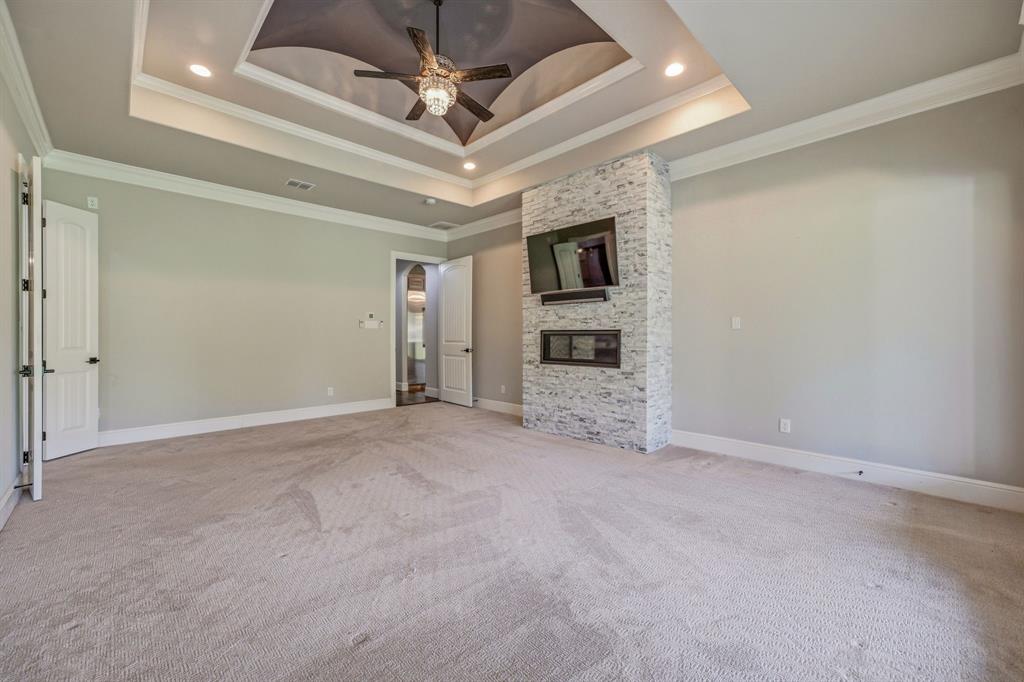 9503 Bellechase Road Granbury, TX 76049 - Photo 16 of 40 en empty room with a ceiling fan and a ceiling fan