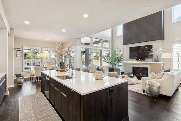 a large kitchen with a large counter top appliances and cabinets