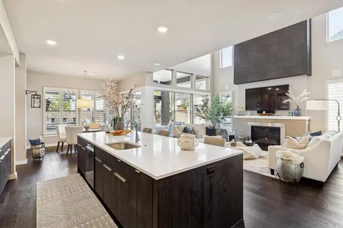 a large kitchen with a large counter top appliances and cabinets