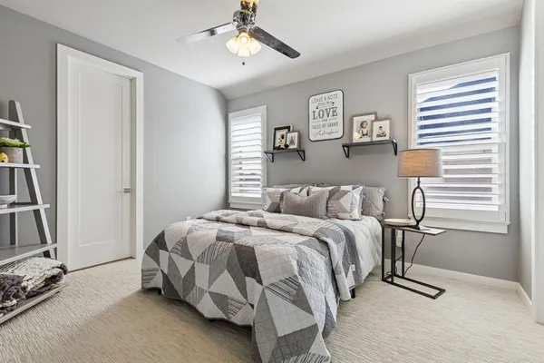 a bed room with a bed and a window