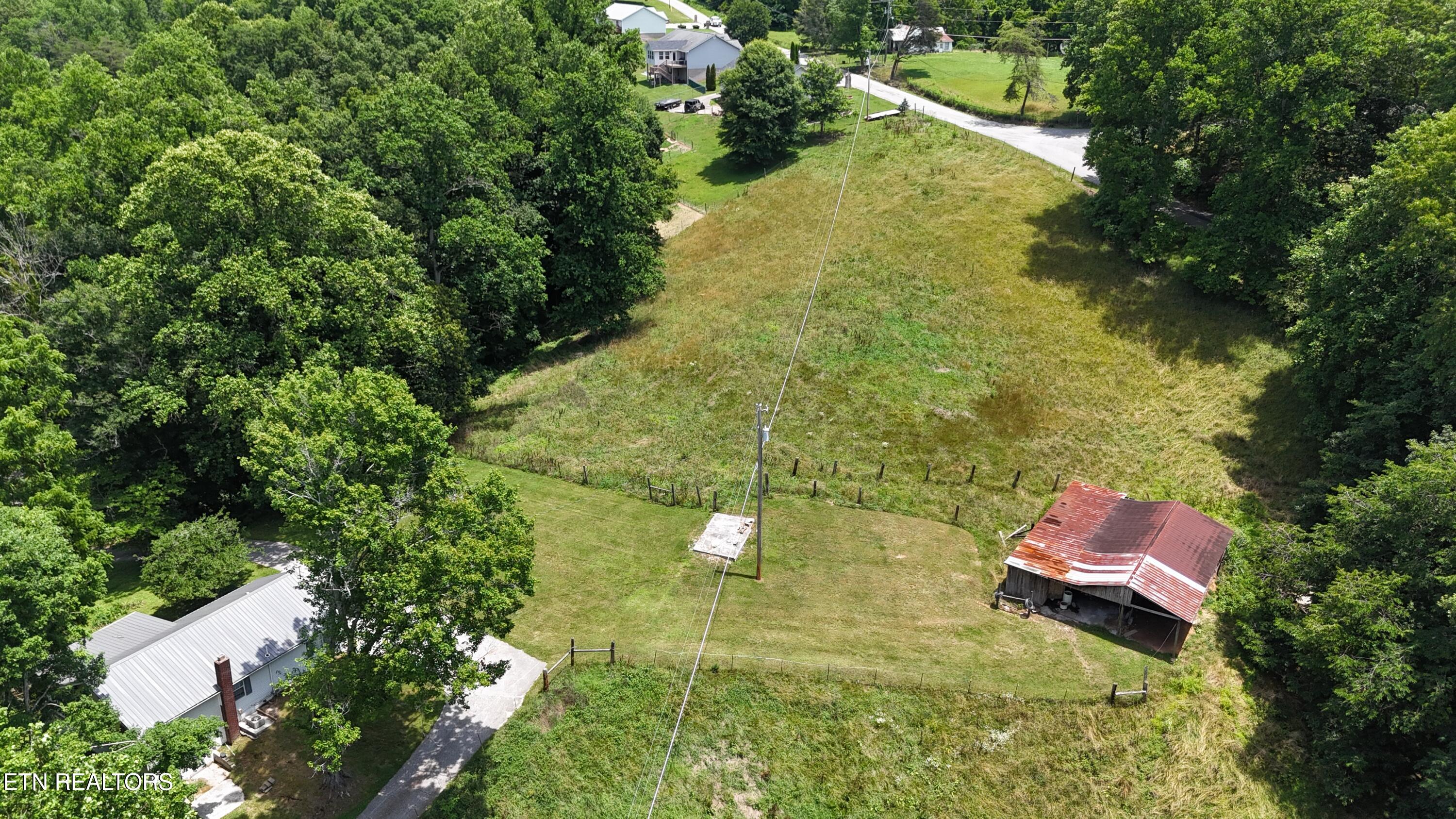105 Echo Valley Road Rocky Top, TN 37769 - Photo 2 of 55 dji_fly_20260619_134038_0085_17818904016