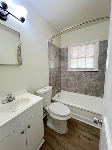 a bathroom with a bathtub and shower